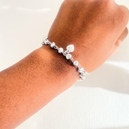 Silver diamond cut bracelet with charms