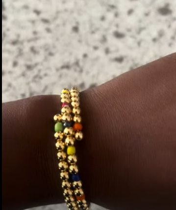 Gold plated adjustable bangle with coloured assorted balls